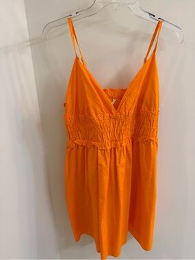 Sim & Sam spaghetti strap shirred crop features a distinct gathered waistline.